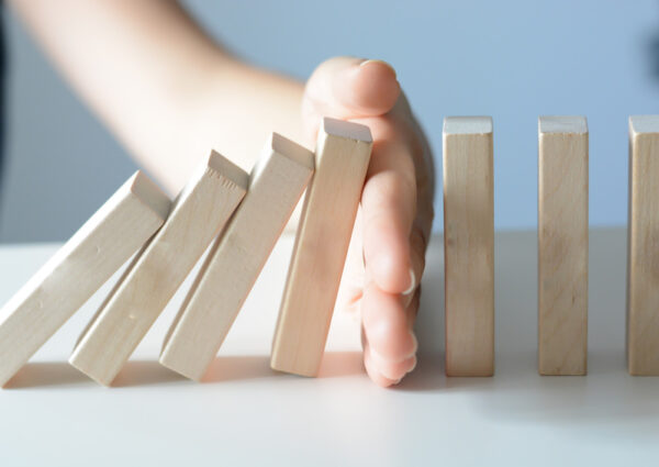 Stopping the domino effect concept with a business solution and intervention