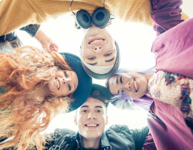 Teens portrait. group of teens hugging together and sharing good mood